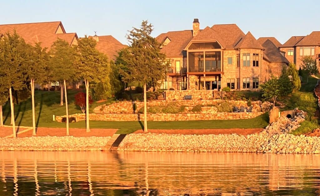 Luxury lakeside home with scenic water views and landscaped yard.